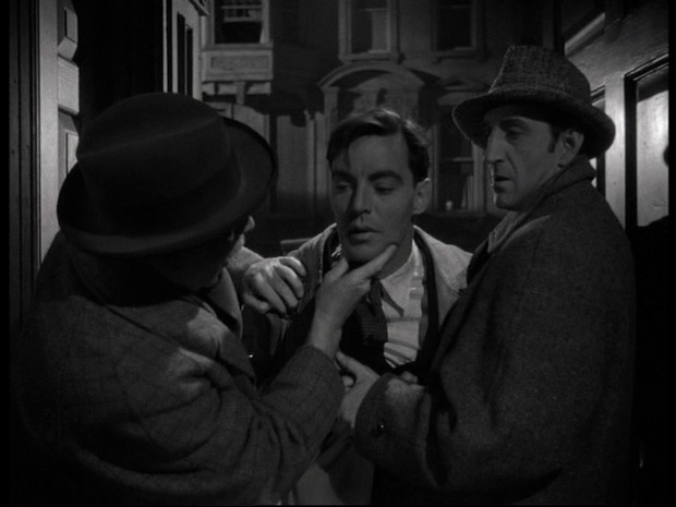 The woman in green (La femme en vert, 1945)  : au centre, Coulter Irwin; à droite, Basil Rathbone est Sherlock Holmes