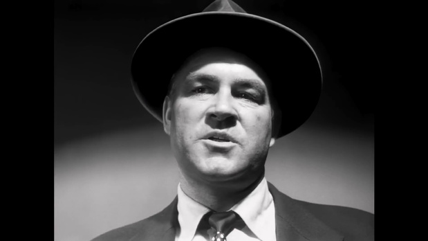 Un policier dans le film noir américain Kansas City Confidential (Le quatrième homme, 1952) de Phil Karlson