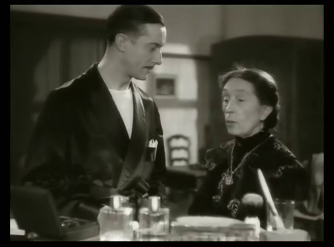 Louis Salou et et Gabrielle Fontan dans le film français Huit hommes dans un château (1942) de Richard Pottier