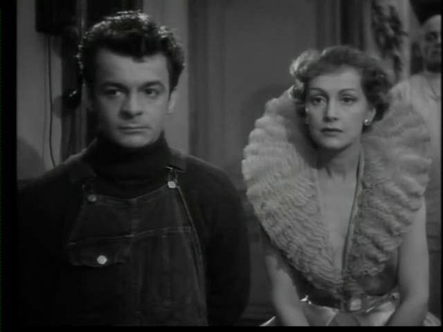 Serge Reggiani et Hélène Perdrière dans le film Le parfum de la dame en noir (1949) de Louis Daquin