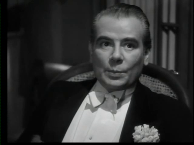 L'acteur Marcel Herrand dans le film policier Le parfum de la dame en noir (1949) de Louis Daquin
