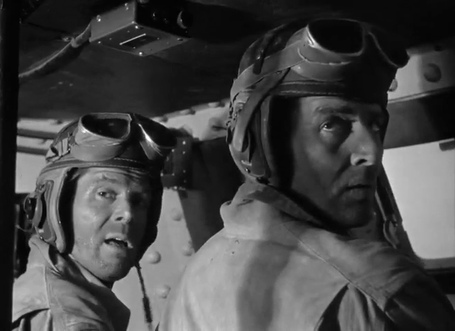 Les acteurs Dan Duryea et Bruce Bennett dans le film de guerre Sahara (1943) de Zoltan Korda