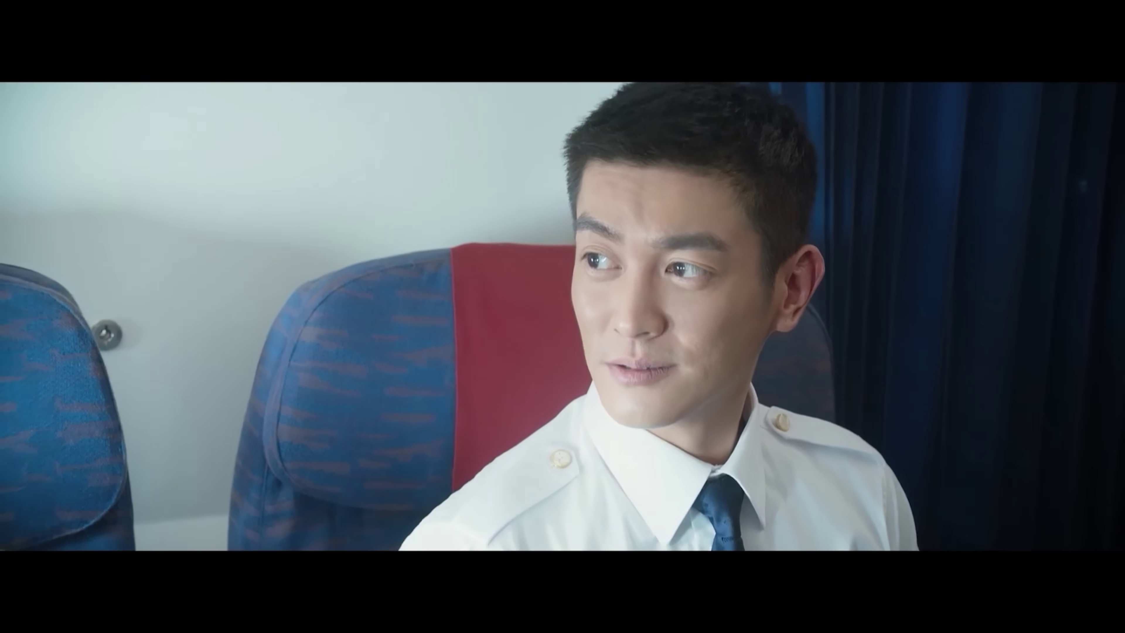 Un pilote d'avion dans le film de catastrophe aérienne 中国机长 (The captain, 2019) de Wai Keung Lau